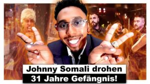 Ein Video-Thumbnail zeigt einen besorgten Mann, der in die Kamera schaut, mit einem Hintergrund, der Gerichtsdokumente und Handschellen darstellt. Der Titel des Videos ist in großer, auffälliger Schrift zu sehen.