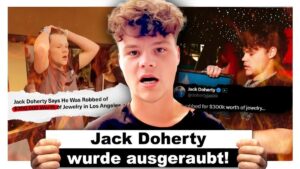 Influencer Jack Doherty live ausgeraubt: Schmuck im Wert von $300.000 weg! Vorschaubild des Videos: Jack Doherty wurde auf offener Straße ausgeraubt, AlphaKevin-Kanal, zeigt Jack Doherty mit schockiertem Gesichtsausdruck und einem unscharfen Hintergrund einer belebten Straße.